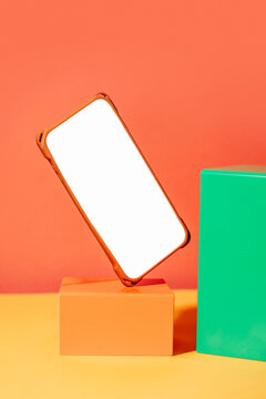 Mobile phone mockup with blank screen and geometric blocks
