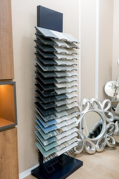 Tile sample display rack in modern interior design showroom