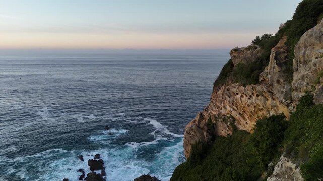Scenic Getaria lighthouse on a cliff at sunset in the Basque Country