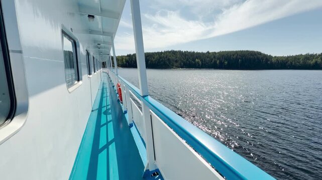 A cruise ship sails along the sparkling waters of Valaam, Lake Ladoga. This peaceful journey inspires calm, happy feelings of joyful adventure and relaxation.