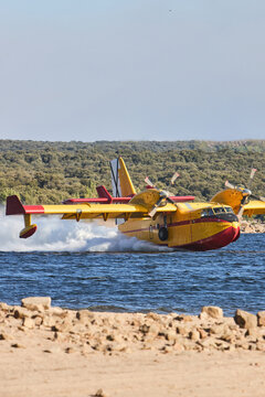 Firefighter bomber plane skim water during aerial operation