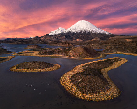 Parinacota Volcano above Lauca National Park wetlands at sunset