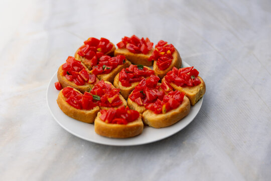 Plate of tomato bruschetta on bread crostini