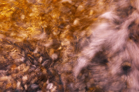 Golden long exposure waves at Helgoland dune beach