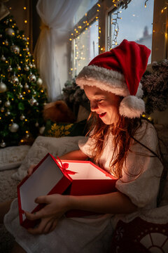 Little girl discovers surprise gift box at Christmas