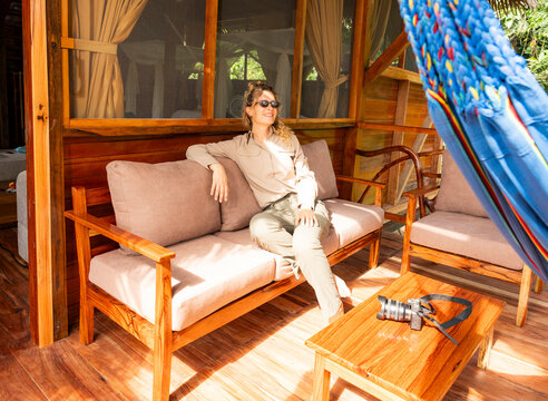 Woman relaxes at an ecolodge in the Amazon forest