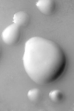Waffle batter droplets in macro view on a metal surface