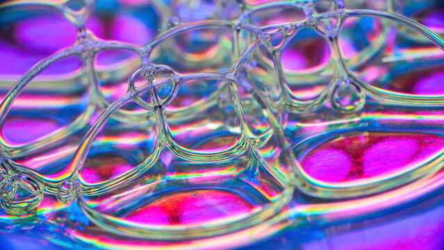 Macro abstract soap bubble pattern with rainbow refraction