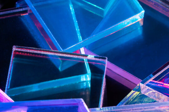 Neon acrylic glass shapes on abstract tech background