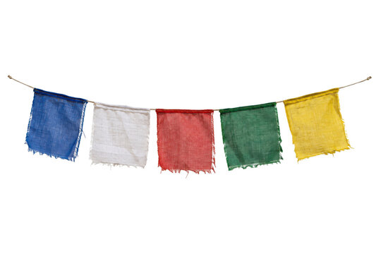 Five colorful, weathered Buddhist prayer flags made of fabric hang horizontally on a string against a clean white background