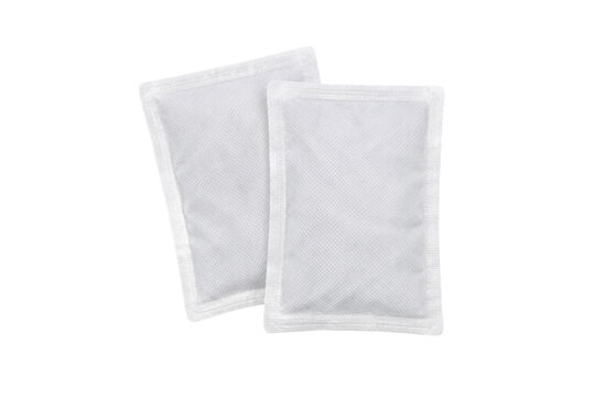 Two white rectangular disposable hand warmers with textured surfaces are arranged on a clean white background