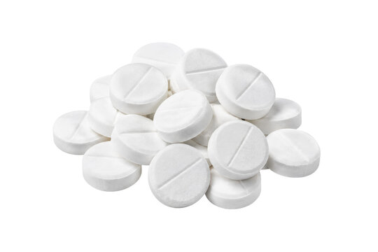 Pile of white round medical pills with a score line, isolated on a clean white background, viewed from a high angle