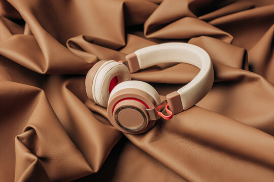 Brown headphones on Mocha Mousse crumpled leather fabric
