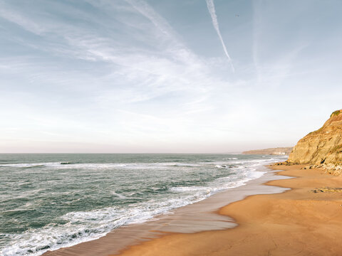 Quiet Atlantic beach and cliff coastline in Portugal