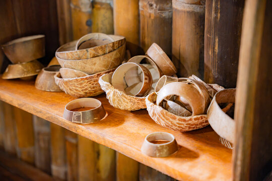 Amazonian handmade bowl and bracelet on rustic wooden shelf