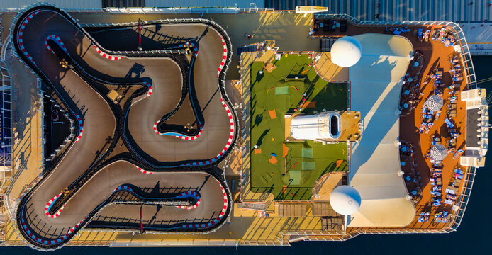 Nassau, The Bahamas - 27 December 2025: Aerial view of Nassau Cruise Port featuring a go-kart track, mini-golf course, and sun deck with lounge chairs.