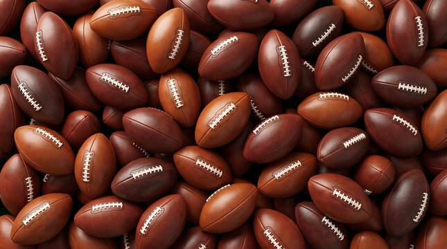 A large collection of american footballs piled together in a dense cluster