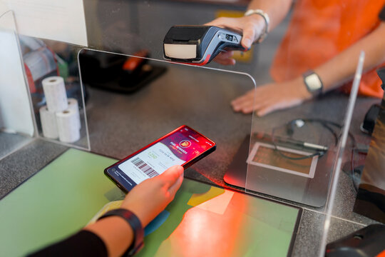 Contactless smartphone payment at gas station checkout counter