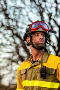 Firefighter in protective gear with goggles and radio