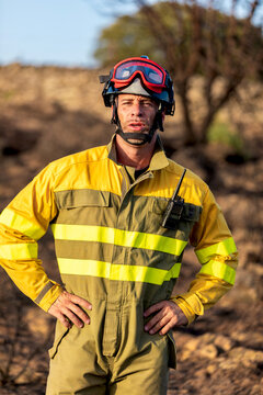 Firefighter in protective gear at wildfire scene
