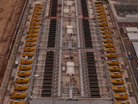 Parque Industrial PyME, Mexico - 18 September 2026: Aerial view of ODATA QR03 data center showing rows of cooling units, industrial infrastructure, and technical equipment.