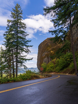 The Historic Columbia River Highway winds along a steep basalt cliff near Shepperds Dell State Natural Area in Multnomah County Oregon.