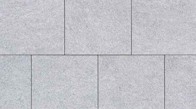 Light gray granite paving tiles texture with offset pattern
