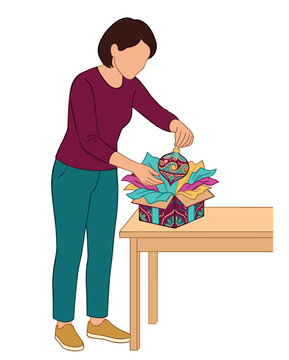 Woman carefully unpacks a colorful decorative ornament from a patterned box filled with vibrant tissue paper, preparing for a special occasion or storage.
