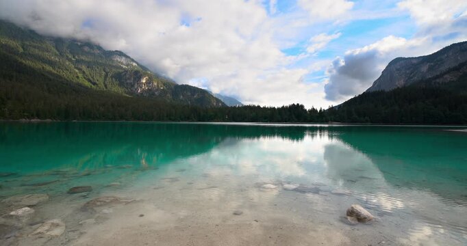 Fantastic landscape at sunrise on lake Tovel.