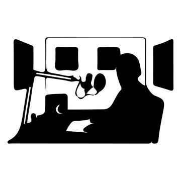 Radio host with headphones speaking into microphone in broadcast studio during live show.