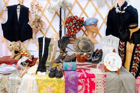 Vintage clothing, hats, and toys market display