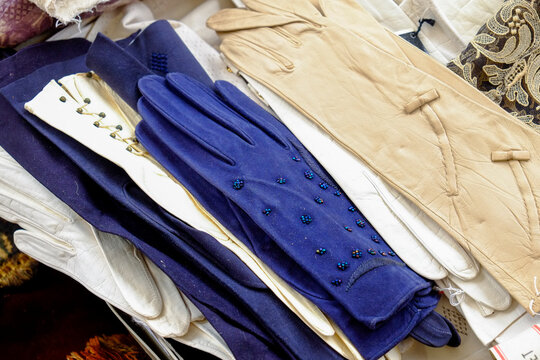 Pairs of vintage gloves display