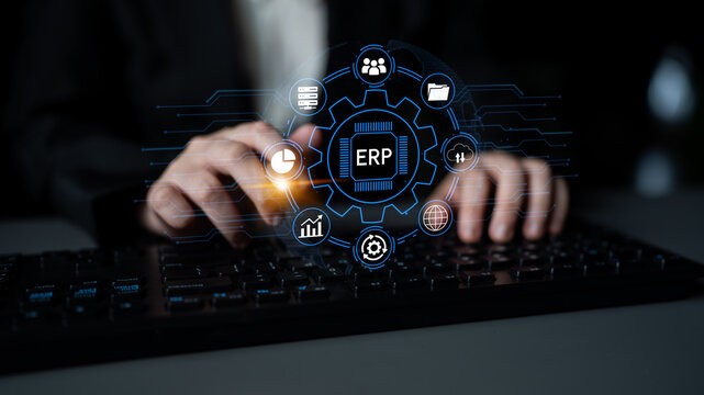 Business Professional Engaging with Advanced ERP System on a Keyboard with Digital Icons Representing Automation, Efficiency, and Management. Entropy.