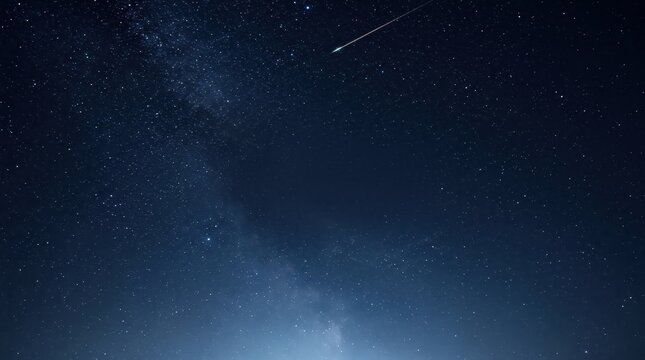 Bright meteor streaking across a star-filled night sky and Milky Way. Astronomy and stargazing. Celestial events and space exploration. Starry sky background for science themes.
