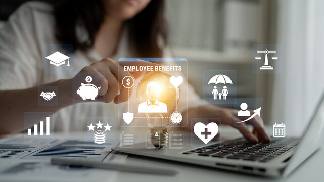 Person interacting with digital icons and symbols about employee benefits, health care, financial growth, and workplace satisfaction in modern office setting Haptic.