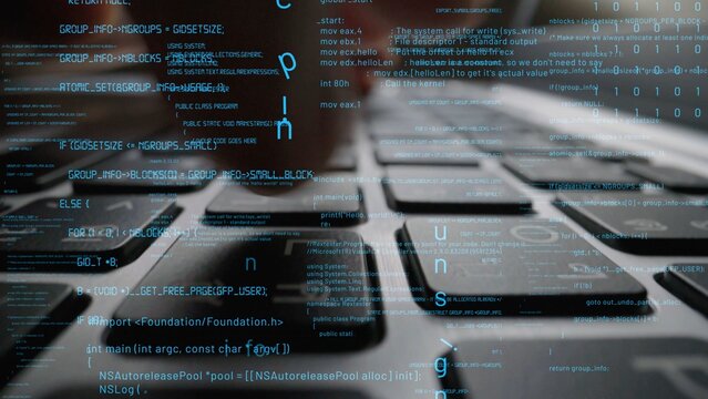 Close-up of a computer keyboard with an overlay of blurred coding data, capturing the essence of programming and modern technology in action. Perfect for tech-related visuals. Xenic
