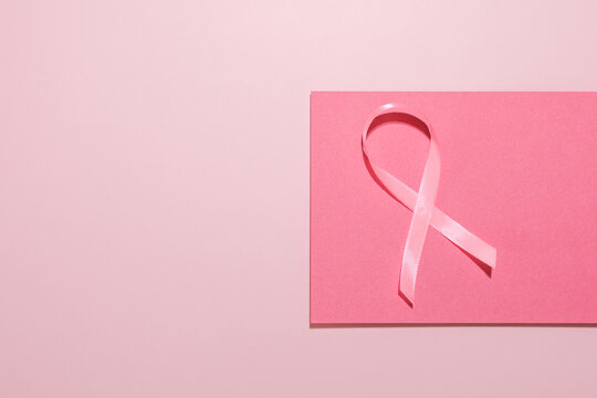 Breast cancer awareness ribbon on pink background