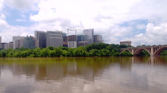 Rosslyn skyline rises across the Potomac River in a waterfront panorama video.
