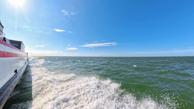  Spray rises beside a ferry during a North Carolina crossing in 4K video.
