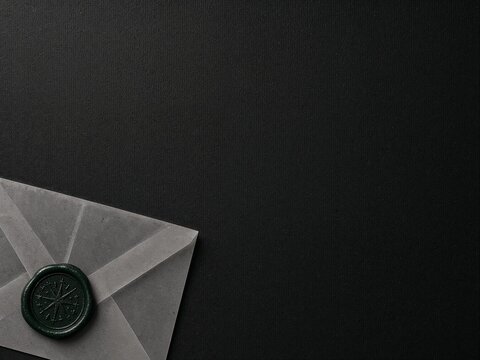 Envelope with wax seal on a dark background  