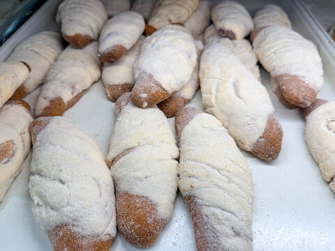 Traditional Mexican Pan Dulce Elotes Sweet Bread in a bakery (Panaderia) Display.