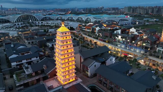 Illuminated Pagoda and Modern City Skyline at Dusk in Xi'an, China