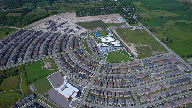 Real estate project construction site in America. Townhouses and Housing building development in North America. Homes in strong pattern replicate bee hive clusters look.