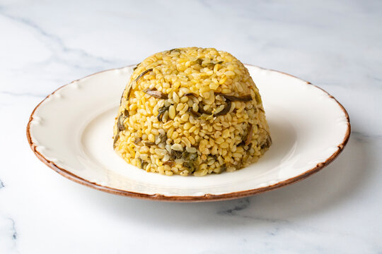 Herbed bulgur pilaf. "Keledos and Ciris herbed" bulgur from Van region of Turkey. Turkish name; Otlu bulgur pilavi