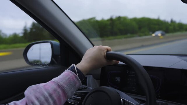 Driving through a scenic route with gentle curves and green