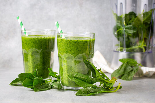 Healthy dieting and nutrition, lifestyle, vegan, alkaline, vegetarian concept. Green smoothie with organic ingredients, vegetables. Spinach smoothie.