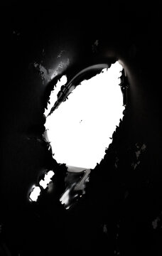 shredded and torn black leathery material, transparent background