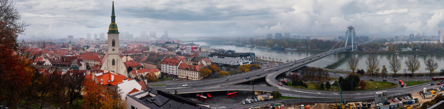 Cityscape, panorama, banner - view of Bratislava with St. Martin's Cathedral and Danube River with Most SNP or New Bridge, Slovakia, 15 November, 2022