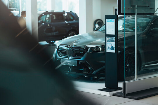 Riga, Latvia June 30 2026, Brand New BMW M5 Luxury sports car in dealer showroom