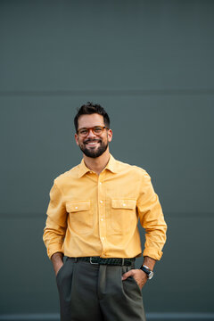 Smiling man wearing glasses with confident expression